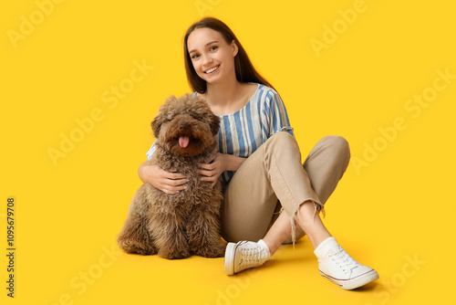 Young woman hugging adorabl...