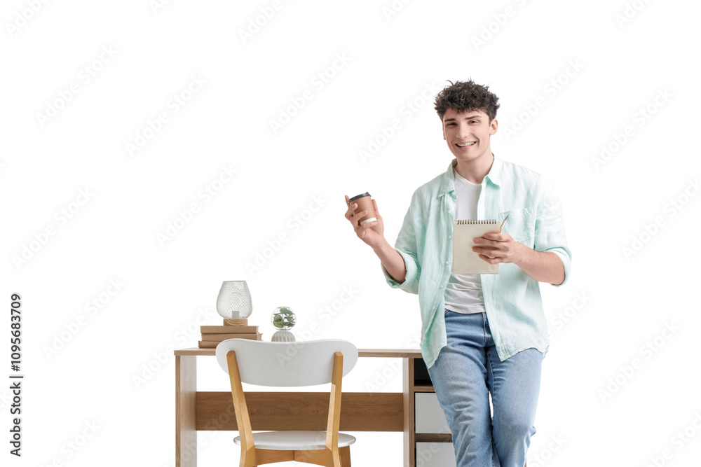 Young man with coffee cup and notebook near desk on white background Young man with coffee cup and notebook near desk on white background