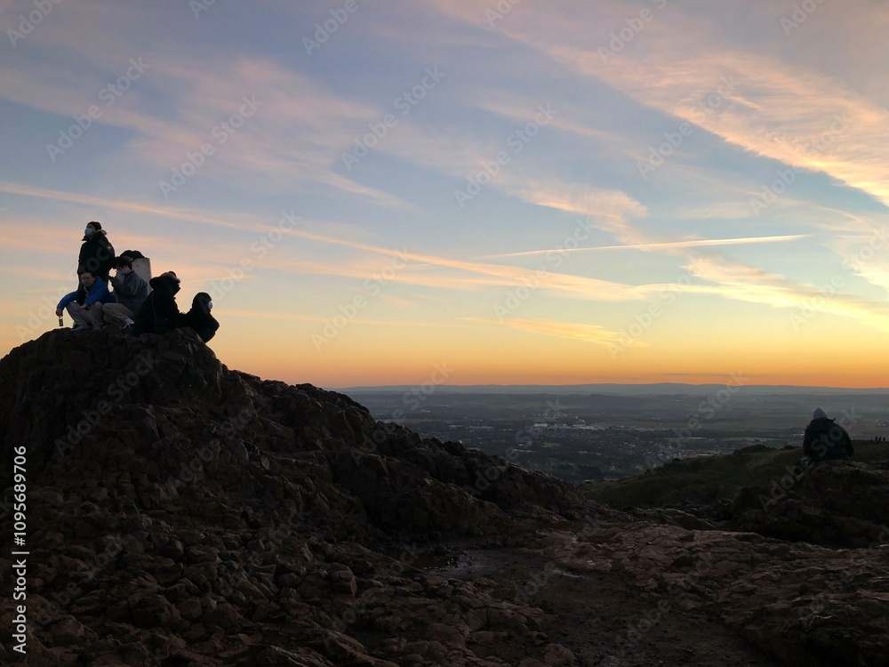 silhouette of a person on the top of mountain silhouette of a person on the top of mountain
