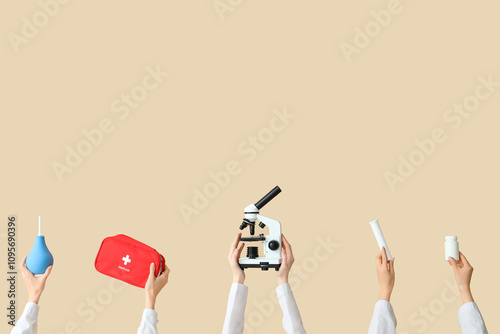 Female hands with microscop...
