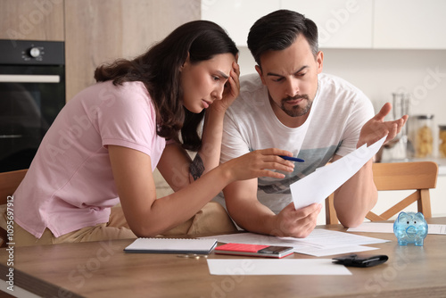Young couple doing calculat...