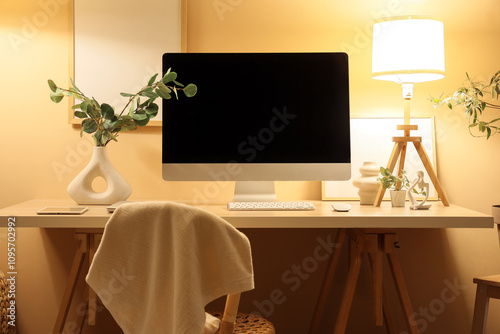 Stylish workplace with mode...