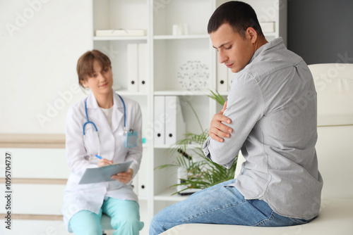 Young man visiting doctor i...