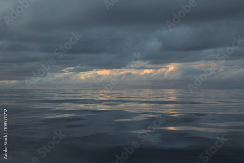 Sunset with clouds over the ocean. Rain is about to come