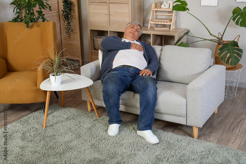 Senior man having heart attack at home Senior man having heart attack at home