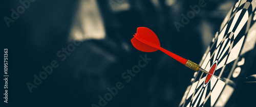 Fotografie Dark bulls eye target or bullseye have red dart arrows throw hitting challenge the center of a shooting for financial business targeting planning growth or aim to winner goal of business win concept