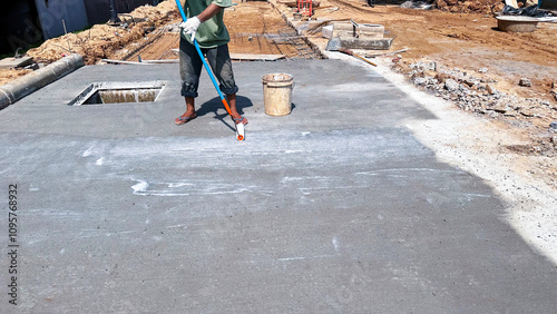 Принти на полотні Technician applies concrete curing agent to prevent cracking
