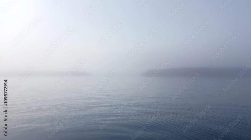 Fototapeta premium Misty Morning at Sea with Soft Reflections