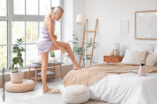 Mature woman using photoepi...