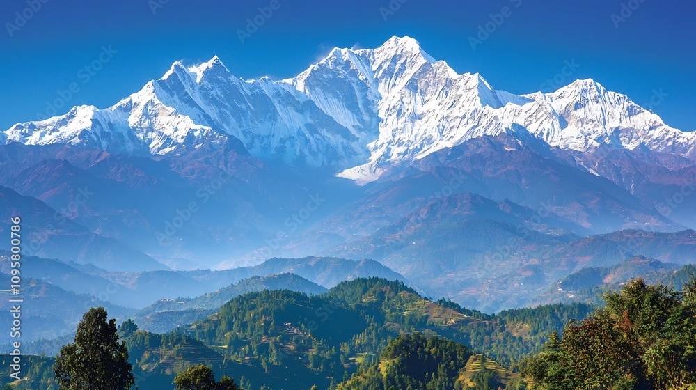 Obraz premium Breathtaking high angle view of a majestic mountain range with snow capped peaks towering above verdant forest valleys in a serene unspoiled wilderness landscape This awe inspiring
