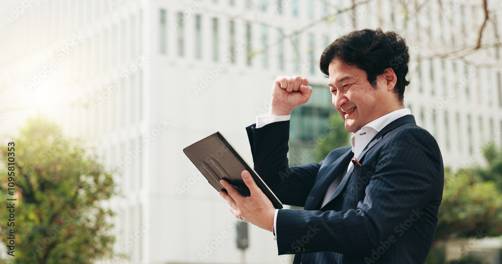 Business, man and fist with tablet in city for good news, financial success and investment growth as winner. Male person, digital app and deal notification for celebration, promotion bonus and Japan