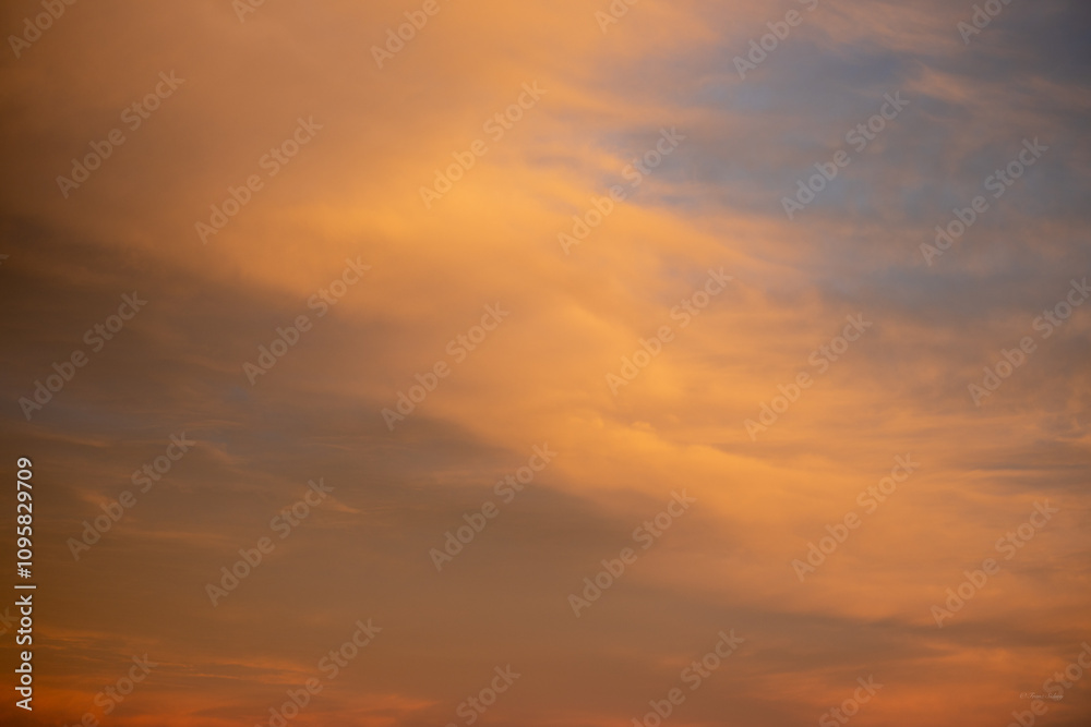 Magnificent golden fluffy clouds at sunset 