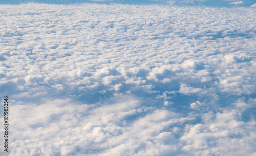 Clouds at the sky. Cloudscape - Blue sky and white clouds. Beautiful blue sky background with clouds. White fluffy clouds in the blue sky. Blue sky and white clouds of daytime