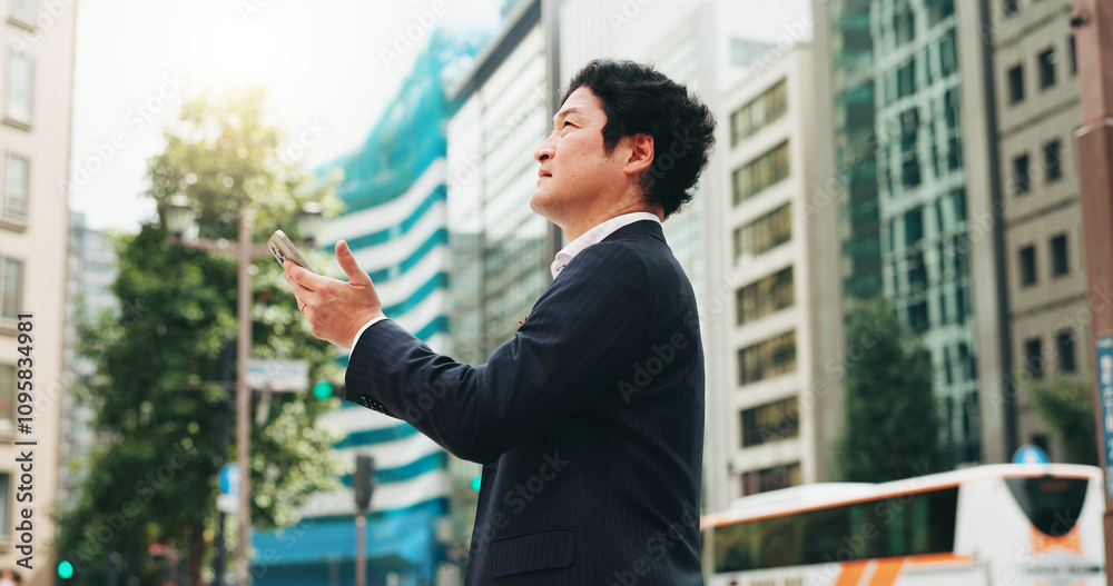 Outdoor, research and man with smartphone, thinking and real estate agent in city and comparing of prices. Morning, mobile and competition analysis for business, realtor or Japanese person in Japan Outdoor, research and man with smartphone, thinking and real estate agent in city and comparing of prices. Morning, mobile and competition analysis for business, realtor or Japanese person in Japan