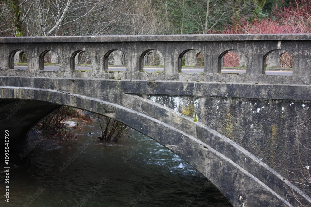 Fototapeta premium Historic Stone Arch Bridge over a Stream