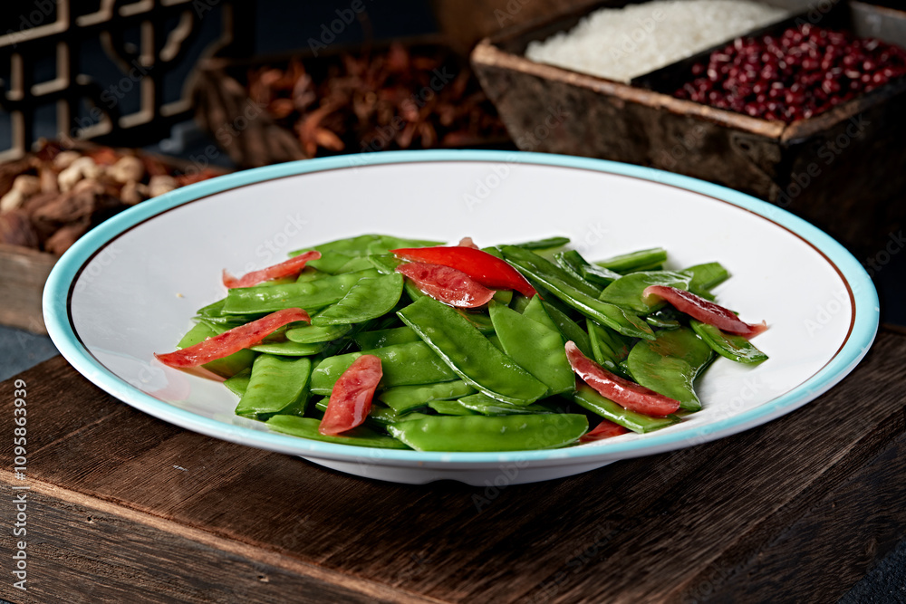 Stir fried snow peas with Cantonese sausage