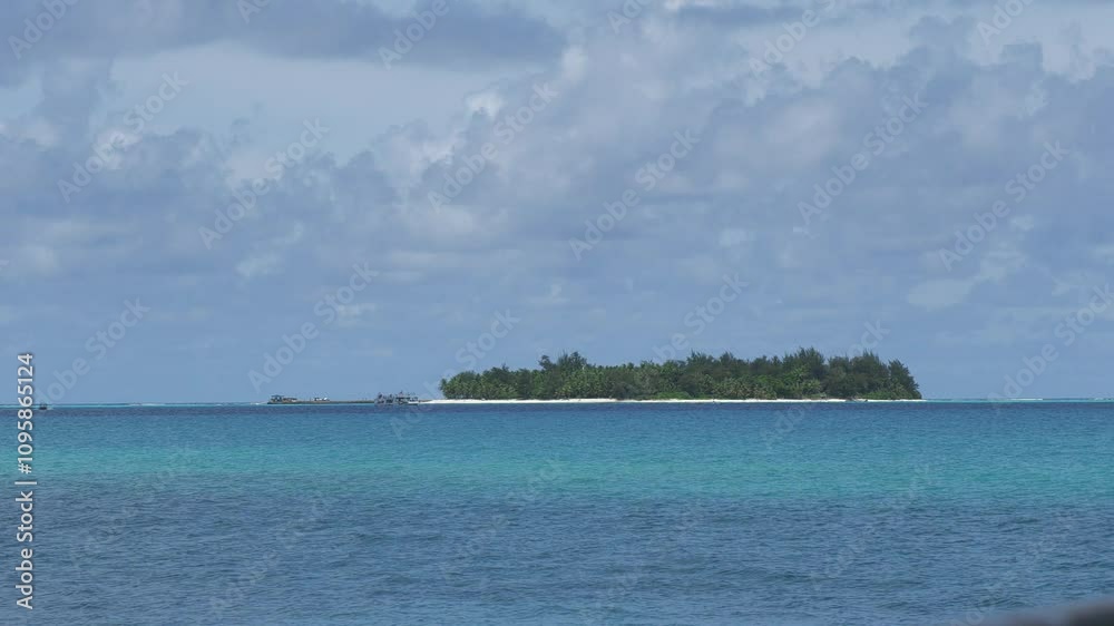 Wide shot of the beautiful Managaha Island surrounded by the pristine waters of the Saipan lagoon. Northern Mariana Islands Wide shot of the beautiful Managaha Island surrounded by the pristine waters of the Saipan lagoon. Northern Mariana Islands