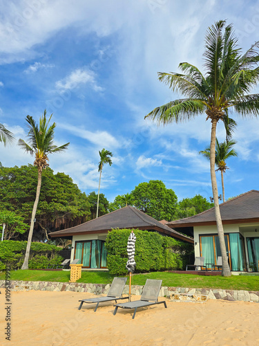 Tranquil beachfront retreat in Thailand with lush greenery and vibrant skies photo