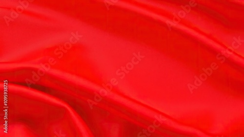 Deliberate blur on red satin fabric for a sense of movement, creative vision, blurred background photo