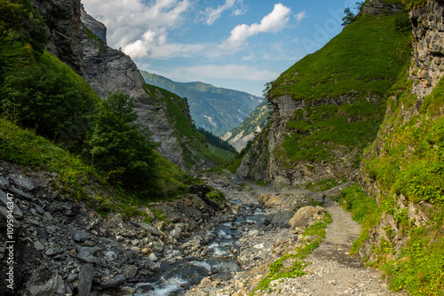 Rocky mountain stream valley in Alps, tranquil trekking trail in Switzerland