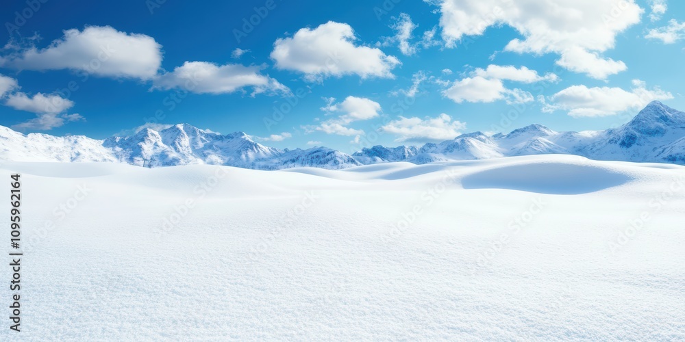 Expansive Winter Wonderland Landscape with Snow-Covered Mountains Under a Bright Blue Sky and Fluffy White Clouds, Perfect for Nature and Travel Themes Expansive Winter Wonderland Landscape with Snow-Covered Mountains Under a Bright Blue Sky and Fluffy White Clouds, Perfect for Nature and Travel Themes