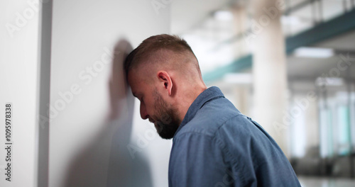 Sad Man Head Against Wall
