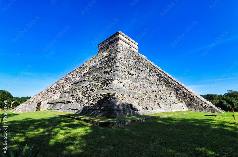 South facing view of Magnificent Temple Pyramid of Kukulcan,known as El Castillo,on a bright day,modern wonder and pinnacle of Mayan architecture built in 10th cent AD in Chichen Itza,Yucatan,Mexico