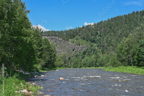 Inzer mountain river flows near Aigir rocks photo