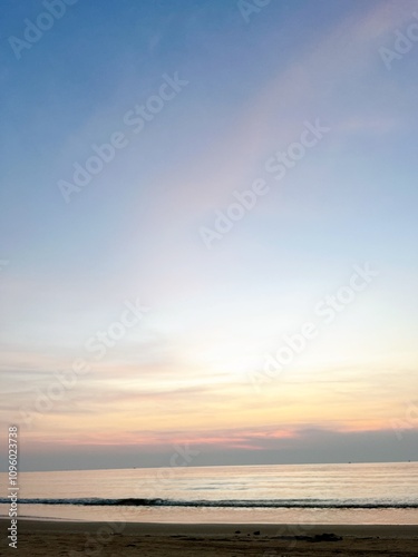 This image captures a blue sky with clouds, showcasing the vastness and beauty of nature. The vibrant blue color of the sky evokes a sense of calm and relaxation, highlighting the serene and 