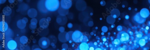 Iridescent blue particles in motion creating a shimmering effect with bokeh background, shimmering, ethereal, particles