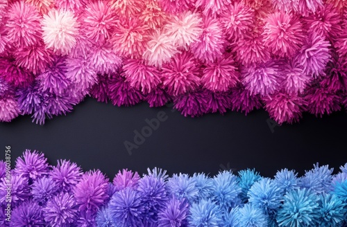 Colorful Pom Poms Arrangement in Shades of Pink and Blue on a Dark Background, Ideal for Crafting and Decorative Concept Projects