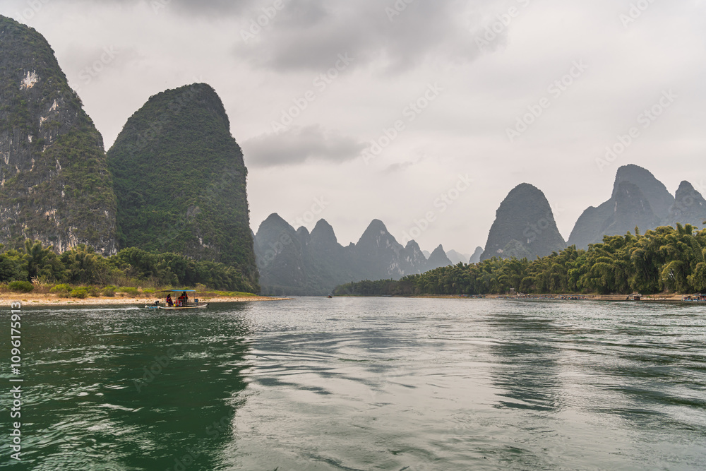 Landscape of Guilin, rural areas. Karst mountains, farmland and small villages. Located near Yangshuo, Guilin, Guangxi, China. Landscape of Guilin, rural areas. Karst mountains, farmland and small villages. Located near Yangshuo, Guilin, Guangxi, China.