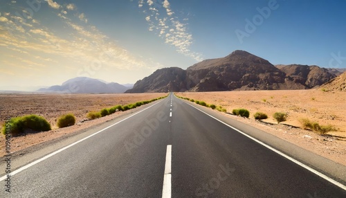 Serene asphalt road through a vast desert landscape, offering an inviting adventure under clear skies, surrounded by natural beauty, emphasizing the freedom of the open road and travel