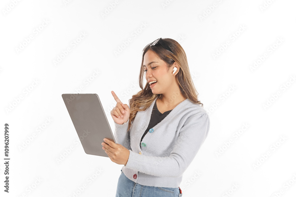 smiling young asian woman wearing airpods and glasses using tablet smiling young asian woman wearing airpods and glasses using tablet
