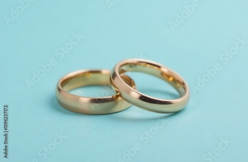 wedding rings on blue background