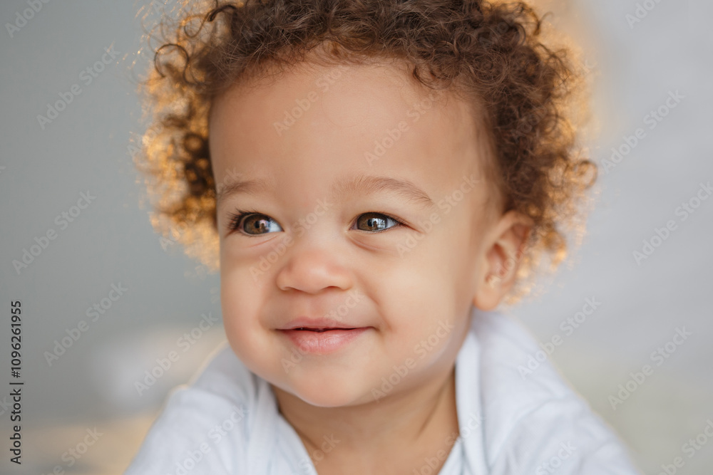 Cute baby with fluffy hair. Pretty boy.
