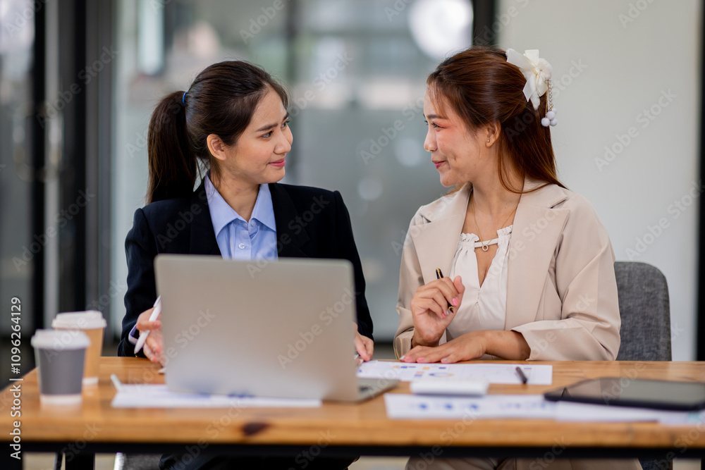 Two asian business women Accounting using calculating income-expenditure and analyzing real estate investment documents data report Financial and tax systems concept.