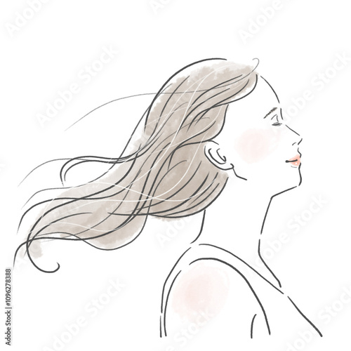 風に髪をたなびかせているロングヘアの若い女性