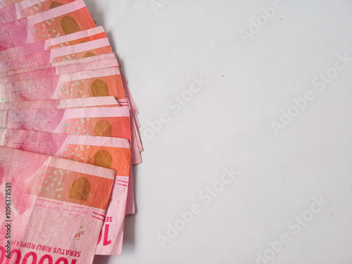 Indonesian money in the hundred thousand rupiah denomination isolated on white background photo