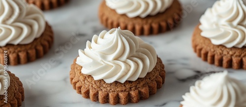 Gingerbread cookies with buttercream frosting on marble surface creating festive sandwich treats perfect for holiday celebrations