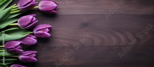Purple tulips beautifully arranged on a rustic wooden table viewed from above showcasing elegance and natural charm in floral decor