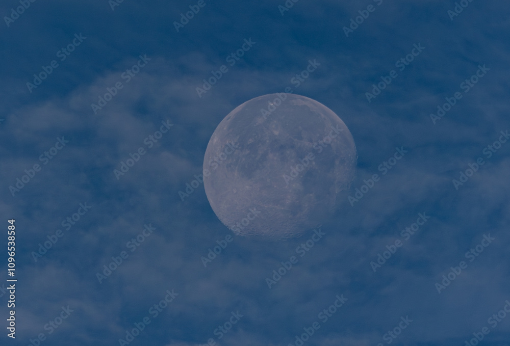 waning moon hiding in the morning between clouds waning moon hiding in the morning between clouds