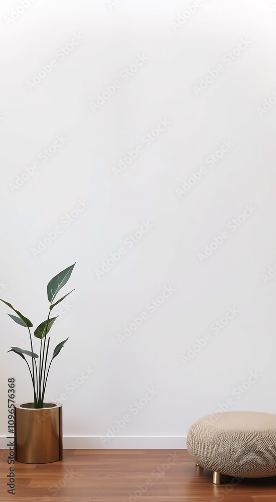 Minimalist interior design with a plant in a pot and a textured ottoman on a hardwood floor. Minimalist interior design with a plant in a pot and a textured ottoman on a hardwood floor.