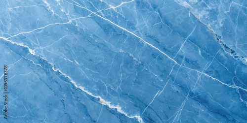 High-resolution image of a blue marble stone texture with white veining patterns photo