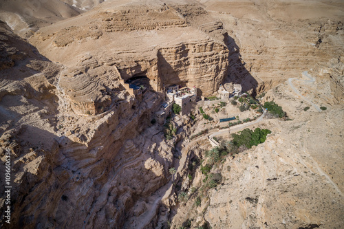 Israel. St. George Orthodox Monastery in Wadi Qelt in Judean desert around. Monastery of St. George of Choziba, Israel. The sixth-century cliff-hanging complex. photo