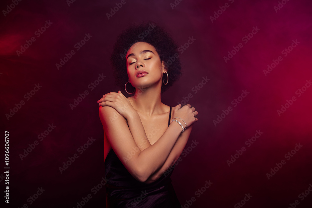 Photo of charming lovely gorgeous model hugging herself tender touch isolated on dark red color background Photo of charming lovely gorgeous model hugging herself tender touch isolated on dark red color background