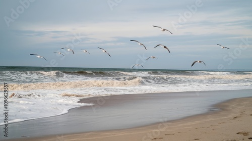 Serene beach with soft white sand, calm turquoise water, and a peaceful sky during a tranquil day by the sea.
