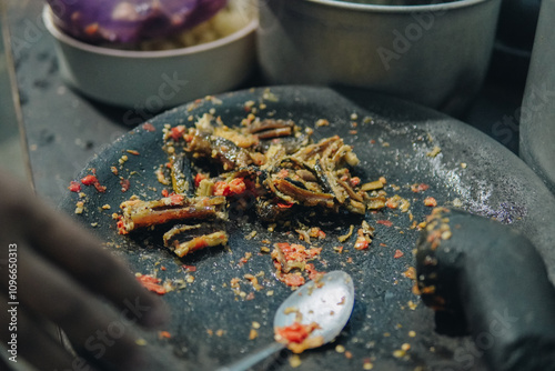 The process of making Sambal Belut or Hot Chili Eel Sauce, a traditional food from Indonesia. photo