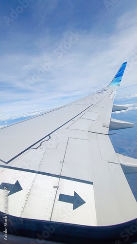 air airplane wings window sky blue clouds travel fly