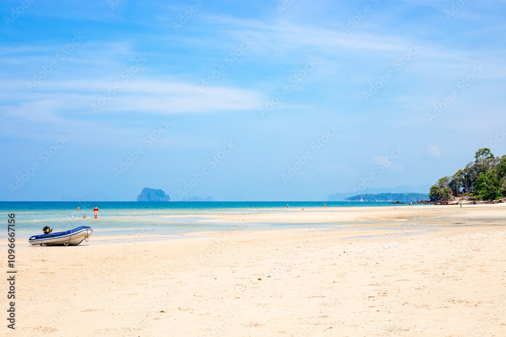 Seascape. Travel and tourism. Sea coast with islands of Krabi province in Thailand, motor boat on the shore Seascape. Travel and tourism. Sea coast with islands of Krabi province in Thailand, motor boat on the shore